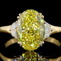 14K Yellow Gold Two-Tone Three Stone Ring with 3.02 Carat Oval Fancy Intense Yellow Lab Diamond and 0.30 Carat Half-Moon Side Stones - Total Carat Weight 3.32 - Covaloro Fine Jewelry