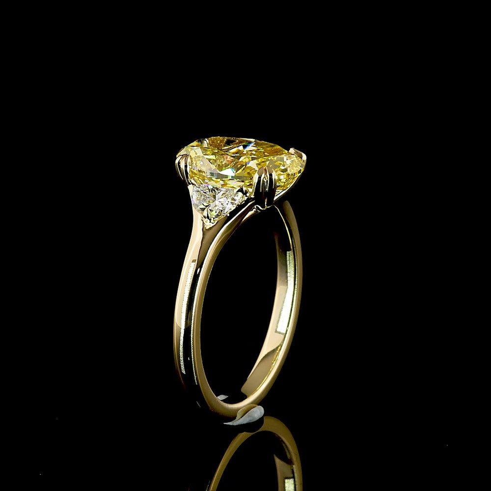 14K Yellow Gold Two-Tone Three Stone Ring with 3.02 Carat Oval Fancy Intense Yellow Lab Diamond and 0.30 Carat Half-Moon Side Stones - Total Carat Weight 3.32 - Covaloro Fine Jewelry