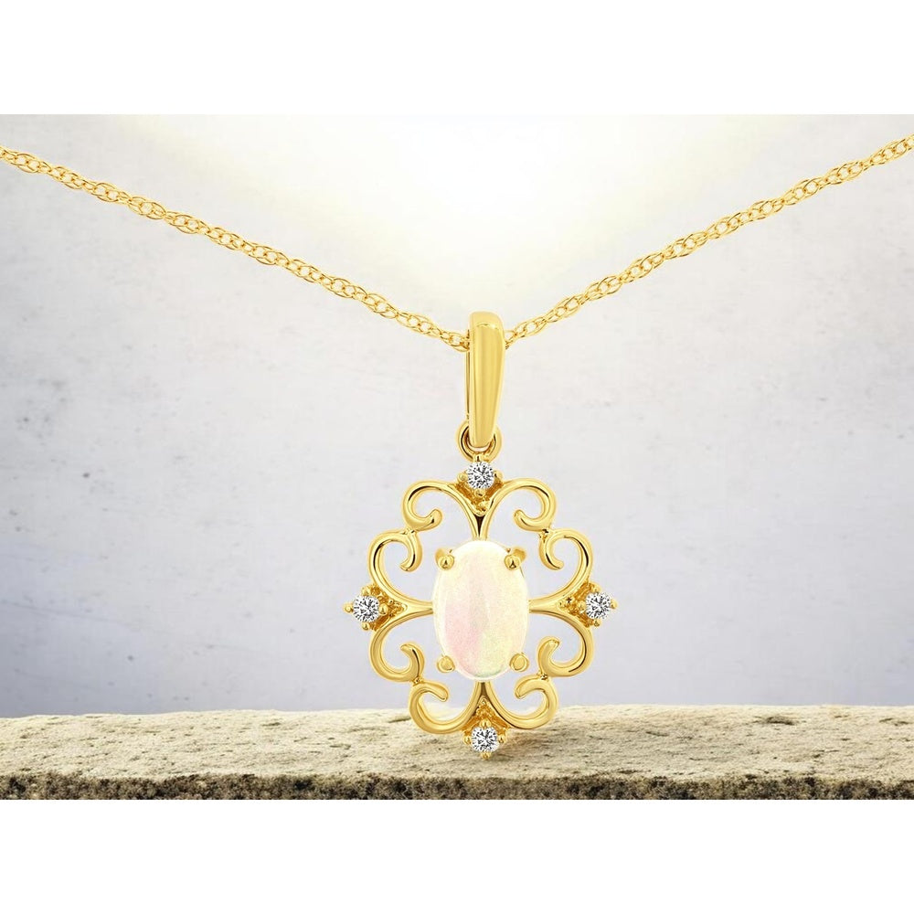 14K Yellow Gold Vintage Scroll Pendant with Oval Opal and Round Diamond Accents - 0.38 Carat Opal and 0.04 Carat Diamond Total Weight - Royal Jewelry