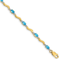 14K Yellow Gold Wavy Link Bracelet with Oval Swiss Blue Topaz and Diamonds - 0.30 Carats Total Gem Weight by Monteluci Fine Jewelry