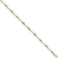 14K Yellow Gold Wavy Link Bracelet with Oval Swiss Blue Topaz and Diamonds - 0.30 Carats Total Gem Weight by Monteluci Fine Jewelry