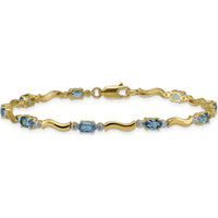 14K Yellow Gold Wavy Link Bracelet with Oval Swiss Blue Topaz and Diamonds - 0.30 Carats Total Gem Weight by Monteluci Fine Jewelry