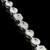 18K White Gold 7.5" Tennis Bracelet with East-West Bezel Set Emerald, Oval, and Pear Cut Lab Diamonds - 10.01 Carat Total Weight - Covaloro Fine Jewelry