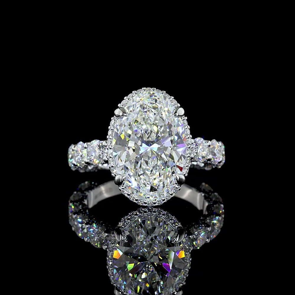 18K White Gold Hidden Halo Ring with 5.01 Carat Oval Cut E VVS2 Lab Diamond and 2.58 Carat Brilliant Round Accent Diamonds - Total 7.59 Carats - Covaloro Fine Jewelry