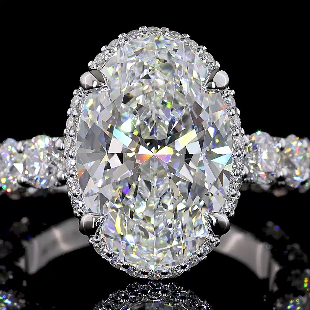 18K White Gold Hidden Halo Ring with 5.01 Carat Oval Cut E VVS2 Lab Diamond and 2.58 Carat Brilliant Round Accent Diamonds - Total 7.59 Carats - Covaloro Fine Jewelry