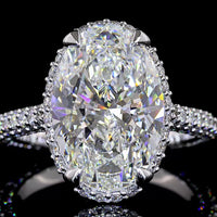 18K White Gold Hidden Halo Ring with 5.09 Carat Oval Cut Lab Diamond Center and 1.39 Carat Accent Diamonds - 6.48 Total Carat Weight - Covaloro Fine Jewelry
