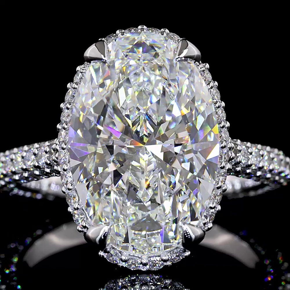 18K White Gold Hidden Halo Ring with 5.09 Carat Oval Cut Lab Diamond Center and 1.39 Carat Accent Diamonds - 6.48 Total Carat Weight - Covaloro Fine Jewelry
