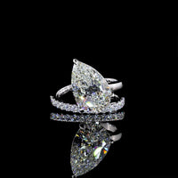 18K White Gold Pear Shape Solitaire Diamond Shank Ring with Inclined Center and Accent Stones - 5.49 Carats Total Diamond Weight (5.04 Carats Center F VS1, 0.45 Carats Side E VS1) - Covaloro Fine Jewelry