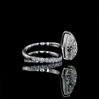 18K White Gold Pear Shape Solitaire Diamond Shank Ring with Inclined Center and Accent Stones - 5.49 Carats Total Diamond Weight (5.04 Carats Center F VS1, 0.45 Carats Side E VS1) - Covaloro Fine Jewelry