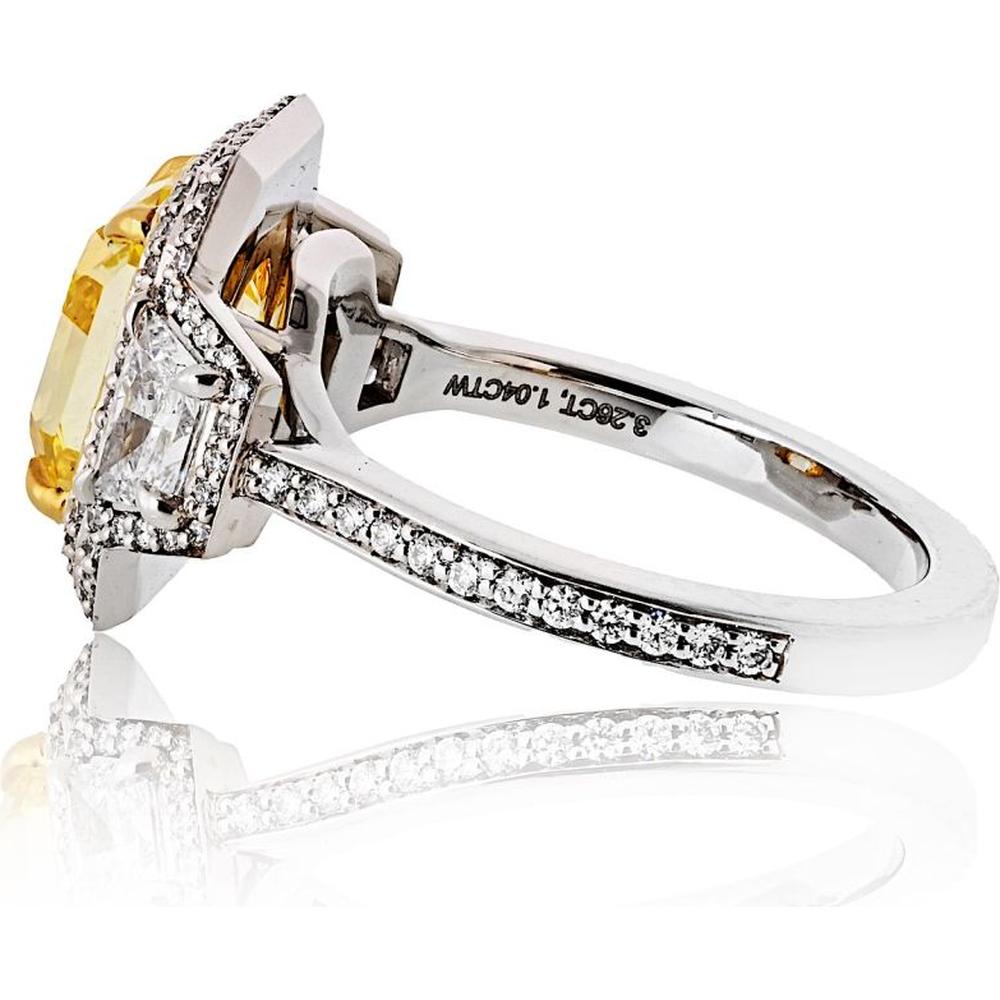 18K Yellow Gold & Platinum 3-Stone Ring with GIA-Certified 3.26 Carats Fancy Vivid Yellow Radiant Diamond and 1.03 Carats Total Side and Halo Diamonds