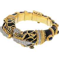 18K Yellow Gold & Platinum Cuff Bracelet with Diamond Ring Clasp and Black Enamel Lion Heads Featuring Sapphire Eyes - Designed by David Webb
