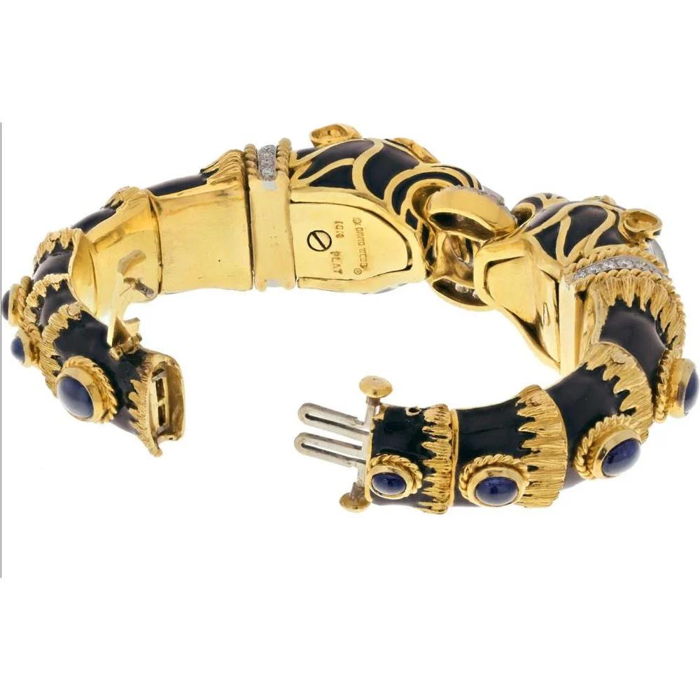 18K Yellow Gold & Platinum Cuff Bracelet with Diamond Ring Clasp and Black Enamel Lion Heads Featuring Sapphire Eyes - Designed by David Webb