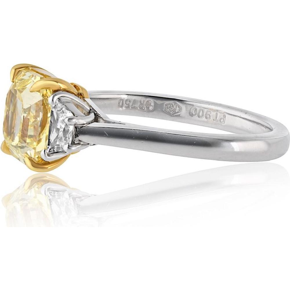 18K Yellow Gold & Platinum Three Stone Ring with 2.02 Carat GIA Fancy Intense Yellow Radiant Cut Diamond and 0.40 Carat Trapezoid Side Diamonds