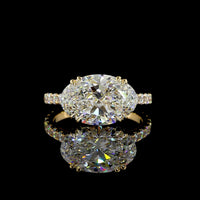 18K Yellow Gold East-West Hidden Halo Ring with 4.13 Carats Oval Lab Diamond and 0.65 Carats Round Diamond Accents - 4.78 Total Carat Weight IGI Certified - Covaloro Fine Jewelry
