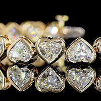 18K Yellow Gold Heart Shaped Diamond Tennis Bracelet with Bezel Set Lab Grown Diamonds - 14.10 Total Carat Weight - Covaloro Fine Jewelry