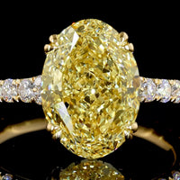 18K Yellow Gold Oval Cut Fancy Vivid Yellow Diamond Solitaire Shank Ring - 4.84 Carat Total Diamond Weight with 18 Round Brilliant Accents - Covaloro Fine Jewelry