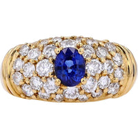 18K Yellow Gold Ring with 0.60 Carat Oval Sapphire Center and 0.95 Carat Round Diamond Cluster