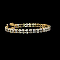 18K Yellow Gold Tennis Bracelet with East-West Set Pear Shaped Lab Diamonds - 3.85 Carats Total Weight, E-F Color, VS Clarity - Covaloro Fine Jewelry