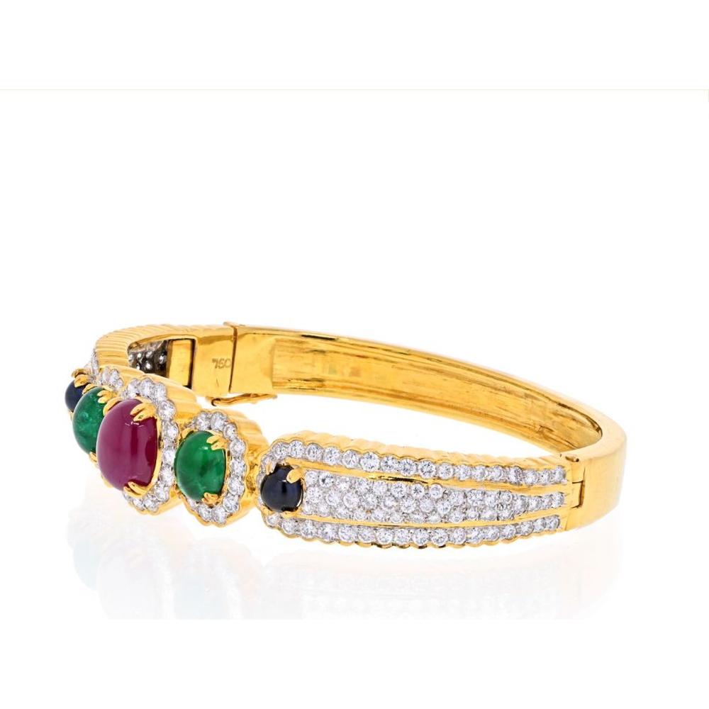 David Webb 18K Yellow Gold Bangle Bracelet with Cabochon Rubies and Enamel Accents - 6.0 Carats Total Ruby Weight