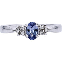 Enchanting 14K White Gold Oval Tanzanite Ring with Diamond Accents - 0.03 Carat Total Diamond Weight