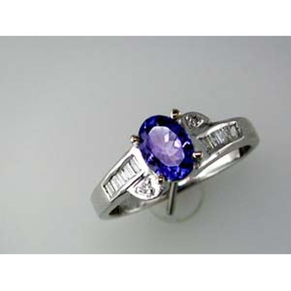 Enchanting 14K White Gold Tanzanite Halo Ring with Baguette Diamonds