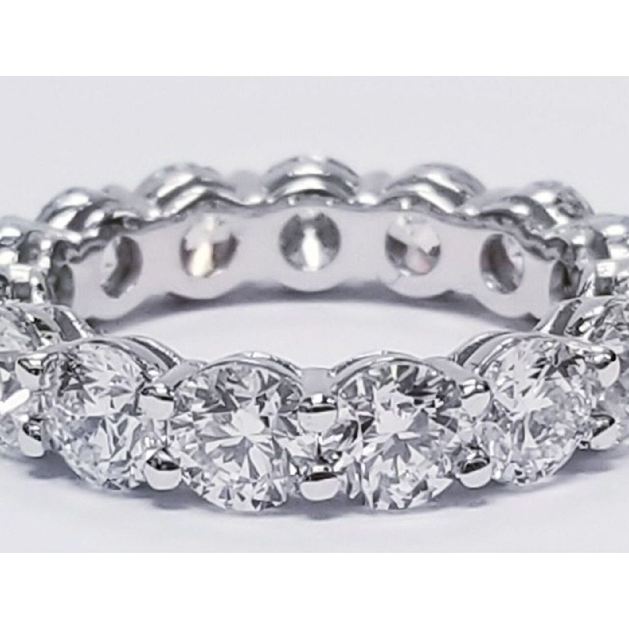 Ninacci Platinum Eternity Band with Shared Prong Set Round Diamonds - D4.57 Carat Total Diamond Weight - Size 5