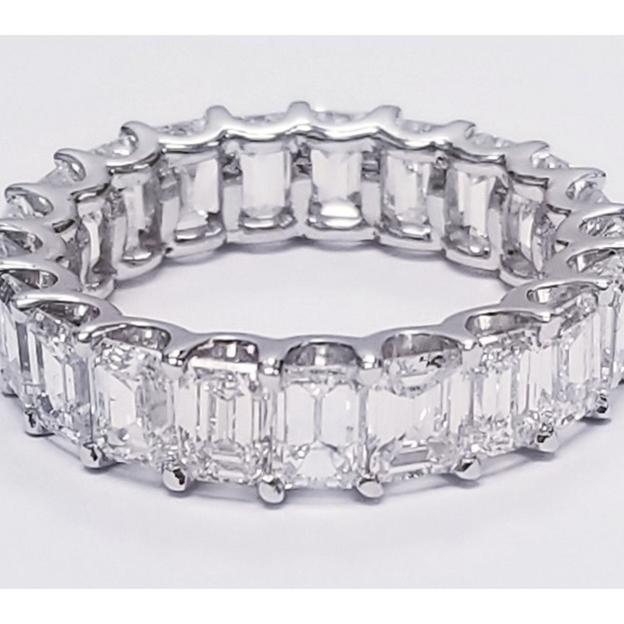 Ninacci Platinum Eternity Band with U-Prong Set Emerald Cut Diamonds - 6.79 Carat Total Diamond Weight - Size 7.0