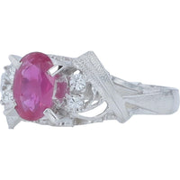 Platinum 0.72 Carat Oval Ruby Ring with 0.05 Carat Round Diamond Accents and Textured Sculptural Band