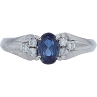 Platinum 0.75 Carat Oval Sapphire Ring with Round Diamond Accents - 0.15 Carat Total Diamond Weight