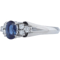 Platinum 0.75 Carat Oval Sapphire Ring with Round Diamond Accents - 0.15 Carat Total Diamond Weight