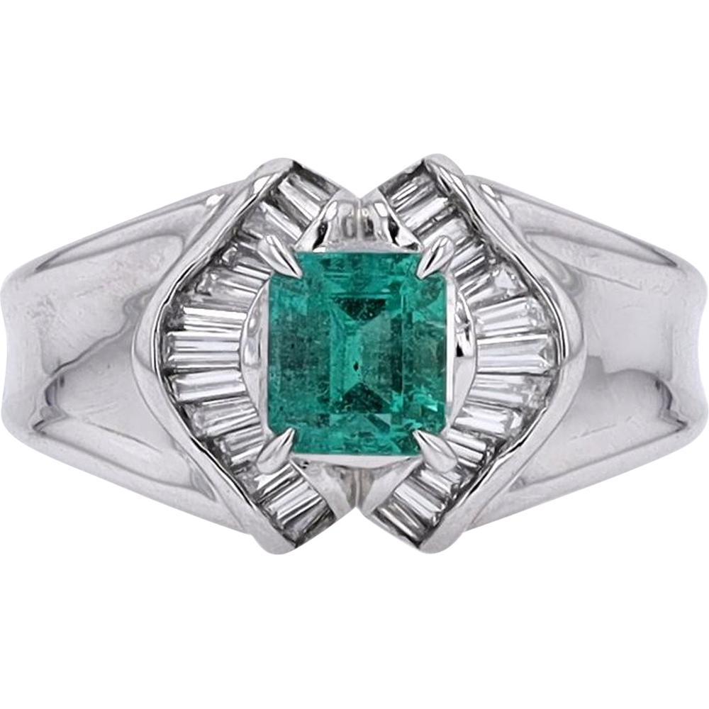 Platinum 0.85 Carat Emerald Ring with 0.33 Carat Baguette Diamond Halo