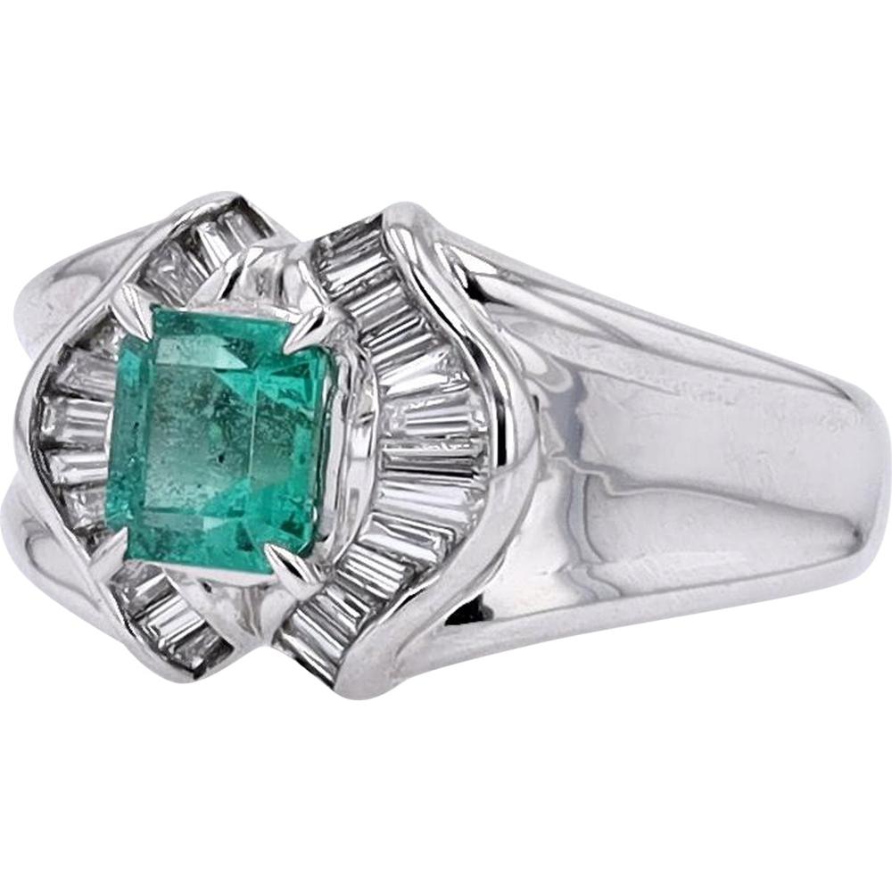 Platinum 0.85 Carat Emerald Ring with 0.33 Carat Baguette Diamond Halo