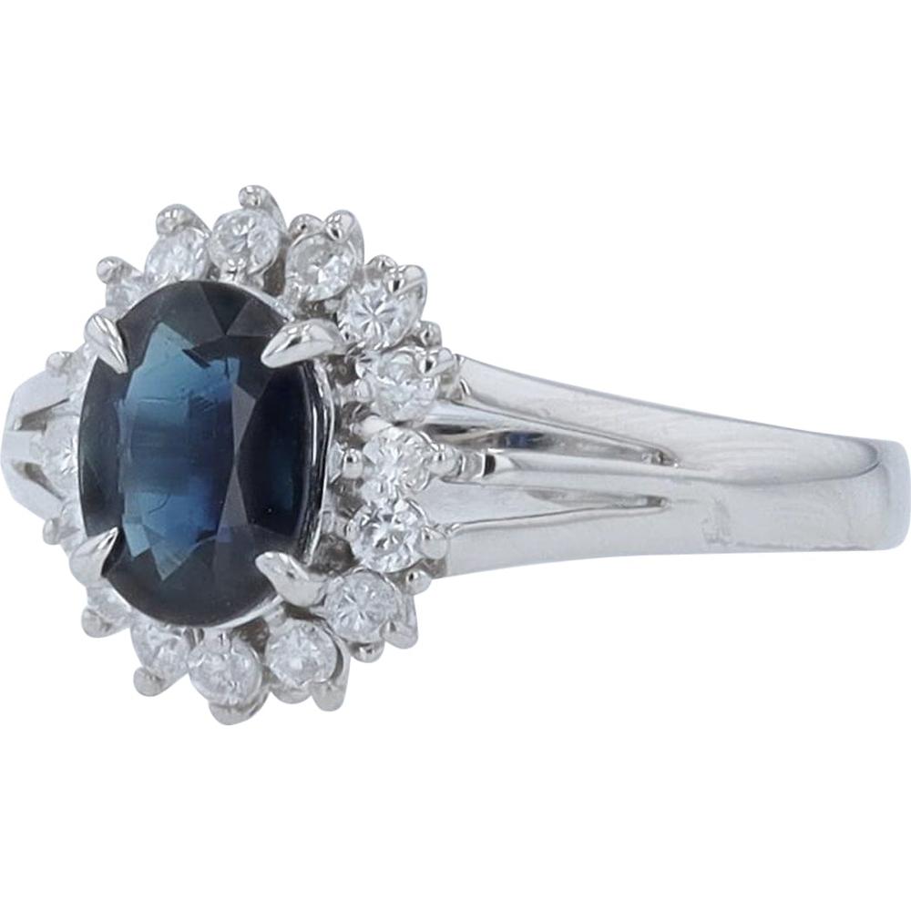 Platinum 0.97 Carat Oval Sapphire Halo Ring with 0.22 Carat Round Diamonds