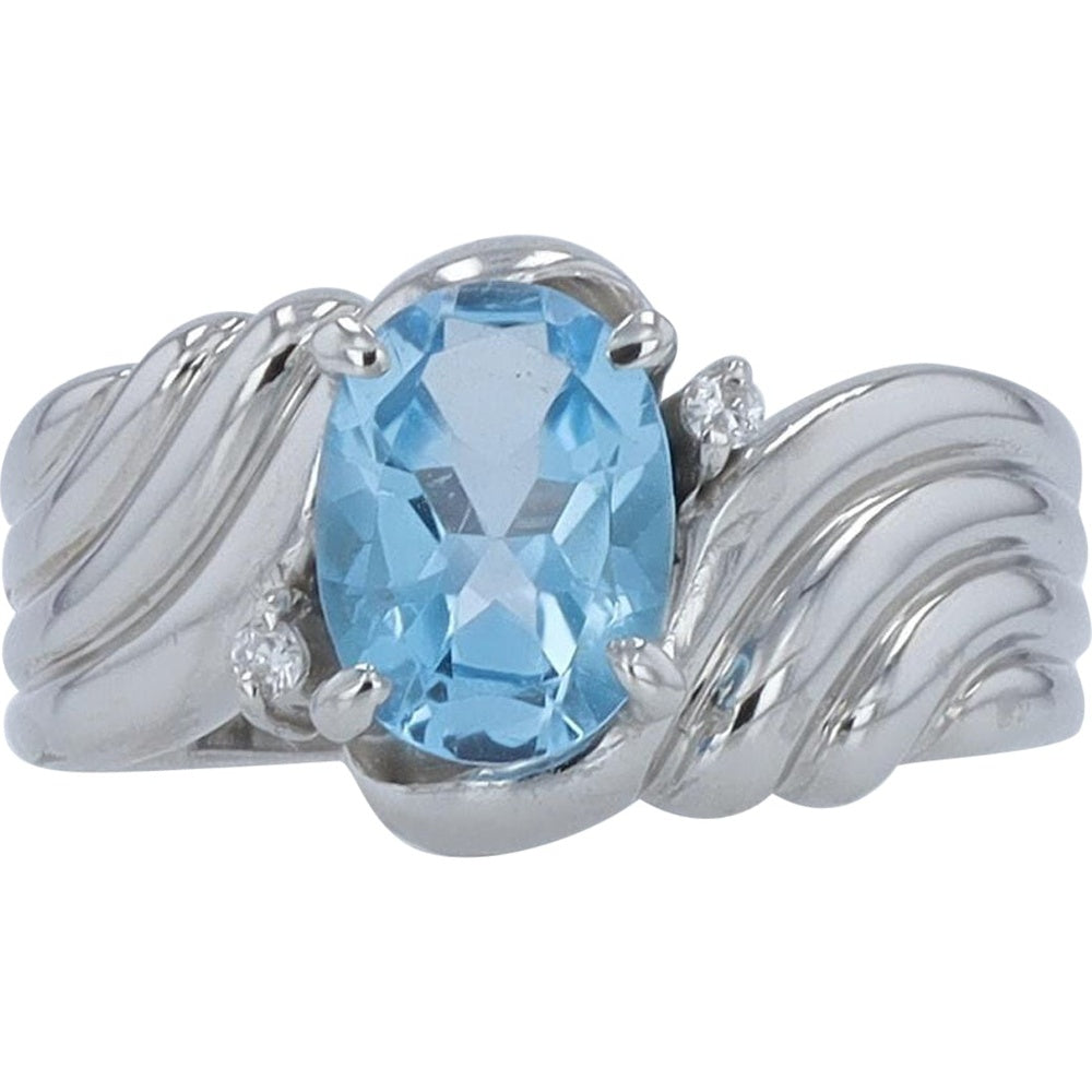Platinum 1.50 Carat Oval Blue Topaz Ring with Diamond Accents - 0.02 Carat Total Diamond Weight