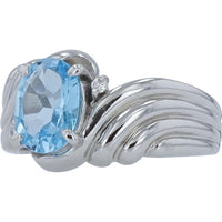 Platinum 1.50 Carat Oval Blue Topaz Ring with Diamond Accents - 0.02 Carat Total Diamond Weight