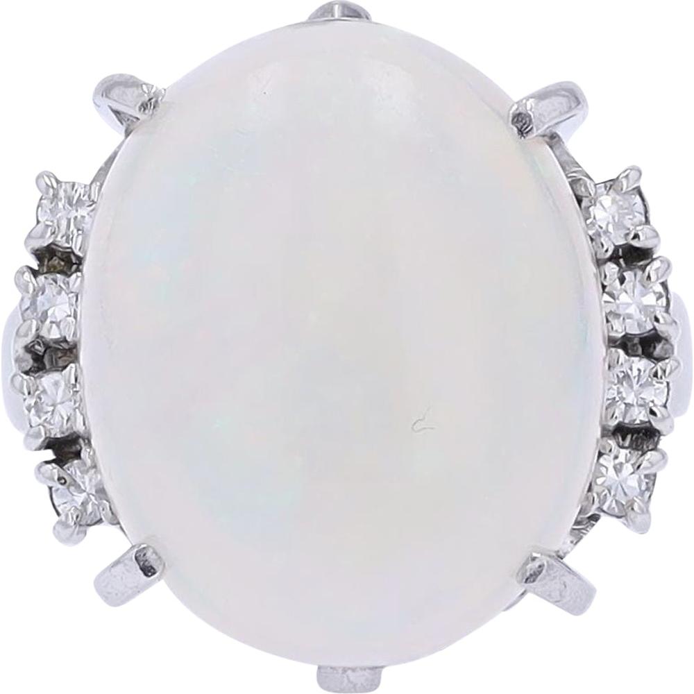 Platinum 10.16 Carat Oval Opal Ring with 0.16 Carat Diamond Accents
