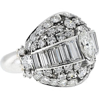 Platinum 1970's Bombe Ring with 5.75 Carats Marquise, Baguette, and Round Cut Diamonds