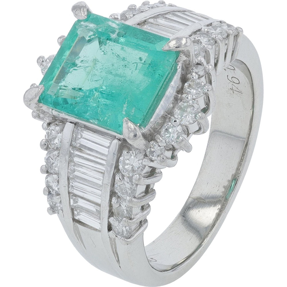 Platinum 2.13 Carat Rectangular Emerald Ring with 0.94 Carat Round and Baguette Diamond Halo Setting