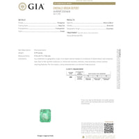 Platinum 3.79 Carat Colombian Emerald Ring with 2.05 Carats Baguette and Round Diamond Halo
