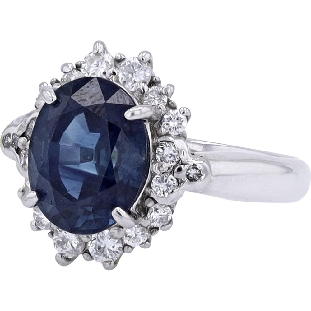 Platinum 3.96 Carat Oval Sapphire Ring with 0.33 Carat Halo Diamonds - GIA Certified