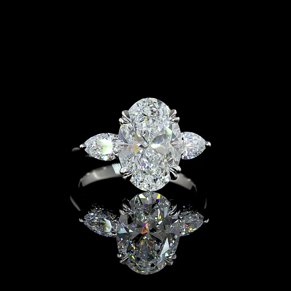 Platinum 3-Stone Ring with 3.50 Carats Oval Cut Lab Diamond and Pear Shape Side Stones - 4.24 Carats Total Diamond Weight - Covaloro Fine Jewelry