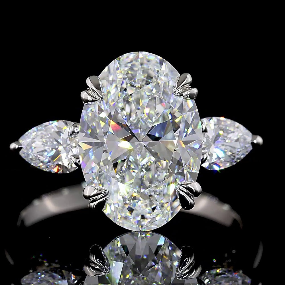 Platinum 3-Stone Ring with 3.50 Carats Oval Cut Lab Diamond and Pear Shape Side Stones - 4.24 Carats Total Diamond Weight - Covaloro Fine Jewelry