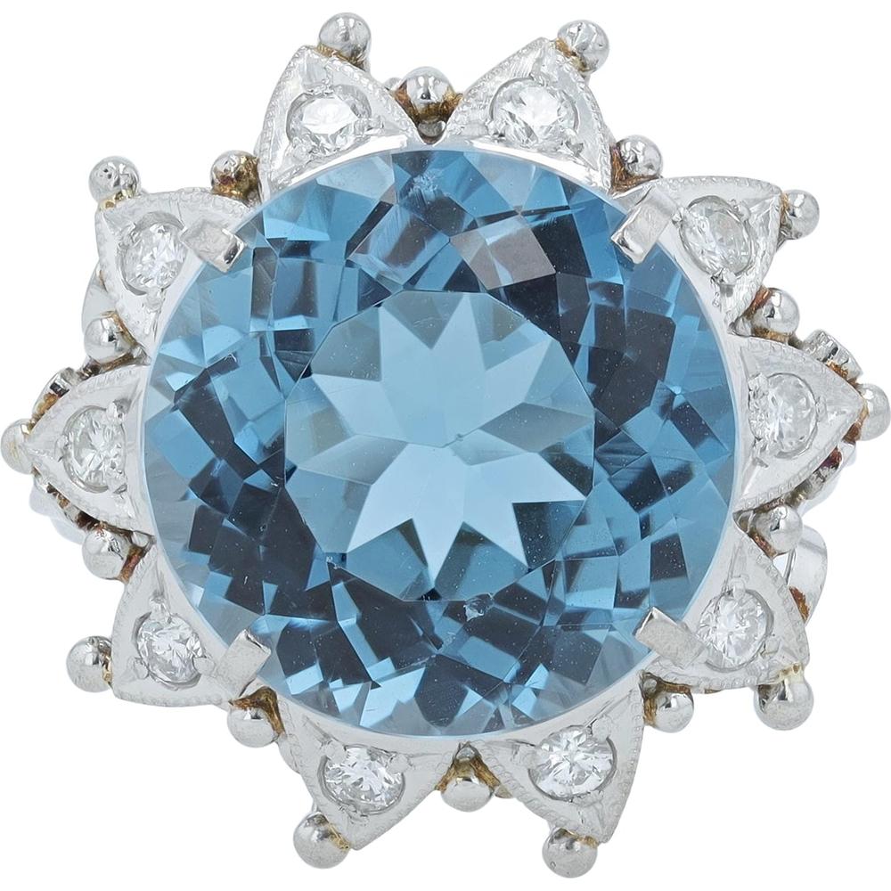 Platinum 9.60 Carat Round Blue Topaz Ring with 0.26 Carat Diamond Halo