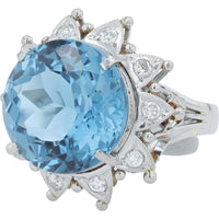 Platinum 9.60 Carat Round Blue Topaz Ring with 0.26 Carat Diamond Halo
