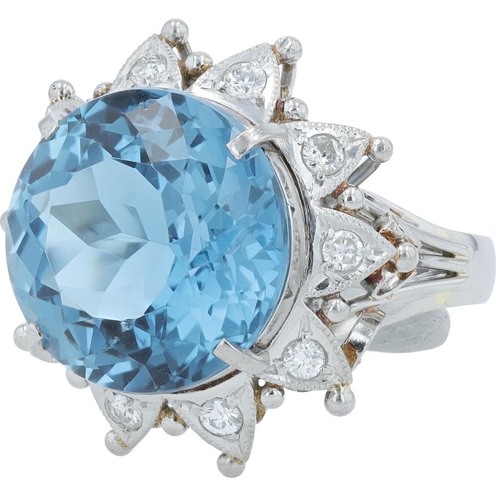 Platinum 9.60 Carat Round Blue Topaz Ring with 0.26 Carat Diamond Halo