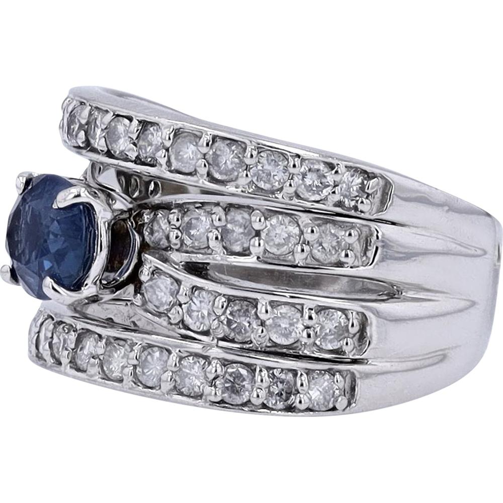 Platinum 900 Crossover Ring with 1.02 Carat Oval Sapphire and 1.10 Carat Round Diamond Accents