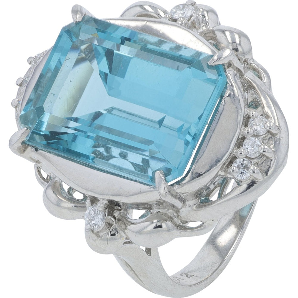 Platinum 900 Free-Form Scroll Ring with 9.58 Carat Emerald-Cut Blue Topaz and 0.12 Carat Diamond Accents