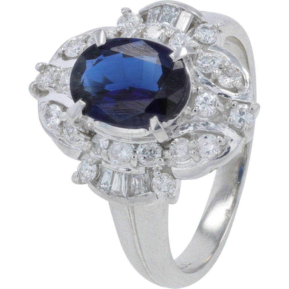 Platinum 900 Halo Ring with 1.44 Carat Oval Sapphire and 0.54 Carat Round and Baguette Diamond Accents - Size 6.5