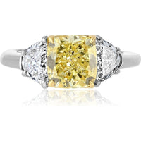 Platinum and 18K Yellow Gold 3-Stone Ring with 2.16 Carats GIA Certified Fancy Intense Yellow Radiant Cut Diamond and Diamond Shields - 0.97 Carats Total Diamond Weight