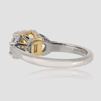 Platinum and 18K Yellow Gold 3-Stone Ring with 2.16 Carats GIA Certified Fancy Intense Yellow Radiant Cut Diamond and Diamond Shields - 0.97 Carats Total Diamond Weight